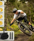 Mountain biker using Two Pack 27.5 Inch Bike Tube With 32mm Schrader Valve For 27.5 X 2.125 To 2.40 Tire Sizes, Durable Butyl Inner Tube With Two Tire Levers, Built For MTB Mountain Bikes And Simple, Quick Installation.