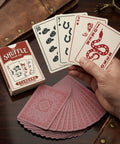Top Shelf Western Playing Cards Single Deck Featuring Dang Right Authentic Wild West Illustrations held in hand with distinct graphics.