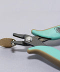 Metal Hole Punch Pliers With Gauge Guard for 22 gauge sheet metal shown punching hole in brass for jewelry making