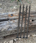 Beefy 16 Inch Rebar Ground Stakes Half Inch Diameter Galvanized Steel Anchors for landscaping shown on wood and soil