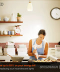 Woman baking in a kitchen with LED A19 Light Bulb 60W Equivalent 9W Energy Efficient 800 Lumens 90 CRI 2700K Soft White