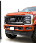 Six And Three Quarter Inch Short Truck Antenna For Ford F 250 2017 To 2026 With Stainless Steel Threading next to a red truck
