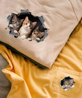 Eight Piece Cat Break Through Wall Iron On Transfers Kit With Eight Kitten Designs For T Shirts Hoodies Jackets Washable DTF Ready To Press Lit DIY Gift For Clothing displayed on beige and yellow shirts.
