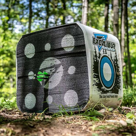 Rugged Four Sided Crossbow Block Target With Carry Handle For High Speed Arrows tough foam archery target in forest setting.