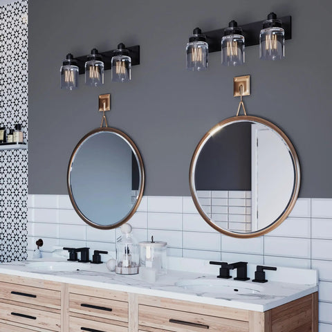 Calhoun Collection Clear Glass Farmhouse Bath Vanity Light Three Light Antique Bronze Finish above double mirrors in bathroom