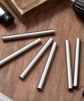 Top Shelf 6 Pack 3/8 X 4 Inch Stainless Steel Dowel Pins heavy duty, placed on wooden surface for DIY bunk bed projects.