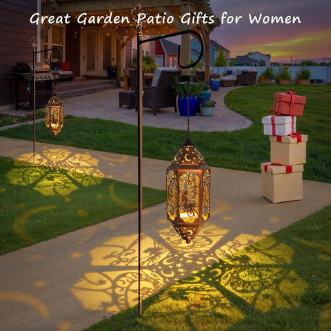 12.4 Inch Solar Outdoor Lanterns Waterproof Garden Lights with moon and star cutouts, red copper, lit in backyard decor.