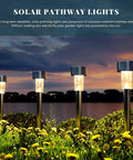 16 Pack Solar Outdoor Lights Pathway Stainless Steel Waterproof LED Landscape Lighting at dusk by water with cold white glow