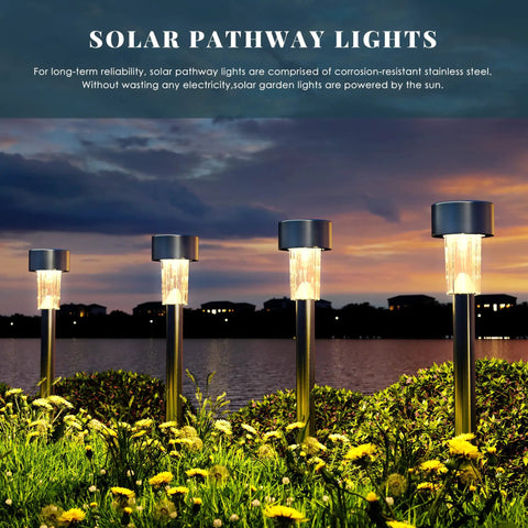 16 Pack Solar Outdoor Lights Pathway Stainless Steel Waterproof LED Landscape Lighting at dusk by water with cold white glow