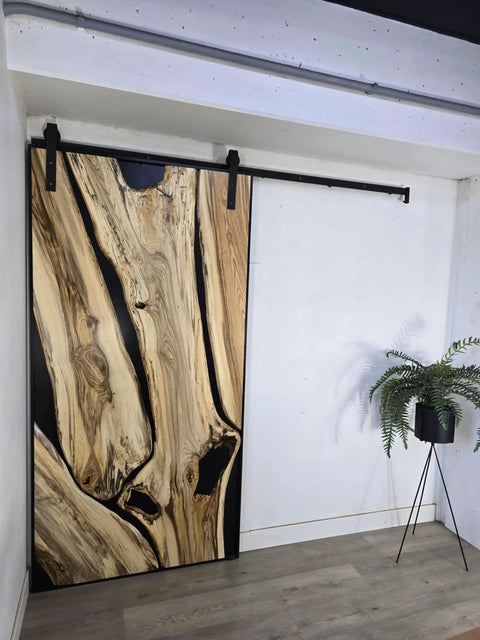 Handcrafted Live Edge Spalted Hackberry Barn Door With Custom Sizing Made To Order In Minnesota Totally One Of A Kind Rustic Modern Wood Door For Hallway Or Entryway, featuring a dark maple frame.
