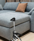 2Pack Ergonomic Arm Lifting Tool Hand Jack For Furniture Tile And Appliance Elevation Adjustable Height Lifter With Clear Markings Beefy Build Makes Big Moves A No Sweat Deal beside a grey couch for easy furniture lifting.