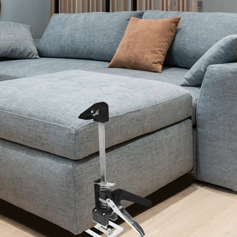 2Pack Ergonomic Arm Lifting Tool Hand Jack For Furniture Tile And Appliance Elevation Adjustable Height Lifter With Clear Markings Beefy Build Makes Big Moves A No Sweat Deal beside a grey couch for easy furniture lifting.