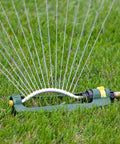TurboTek 3200 Sq Ft Oscillating Sprinkler With 16 Rubber Nozzles QuickConnect Adapter on green lawn