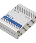 Instant LTE Failover Router And Firewall With CAT12 4G LTE Dual Band WiFi 802.11ac GNSS GPS Bluetooth No Nonsense Security Biz Grade VPNs And Uninterrupted Connectivity For Remote Sites Fleets And Mobile Installations product in metallic casing with multiple ports on one side, viewed from a top angle.