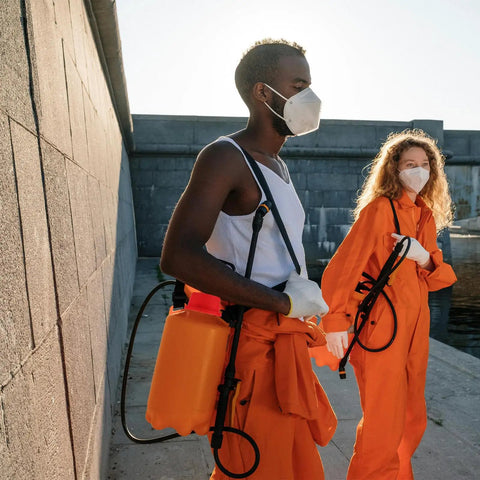Two people in safety gear using knapsack sprayers with 142mm Barrel Mouth Filter Net for garden spraying and irrigation.