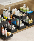 Four Pack Two Tier Under Sink Organizer With Hassle Free Slide Out Drawers For Bathroom Vanities And Kitchen Cabinets showcasing black racks filled with cleaning supplies and towels.