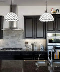 Kitchen with two Tiffany Style Hanging Pendant Lamp 12 Inch Stained Glass With White Jeweled Inset over a marble island.