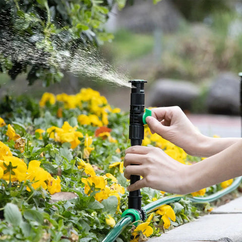 Flexible Sprinkler System With Metal Spike Base, Above Ground DIY Irrigation Kit in flower bed, green hose included