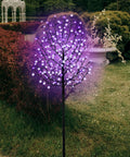 6 Foot Solar Cherry Blossom Tree Light With 200 LED Purple Lights That Look Lit For Garden Patio Yard Outdoor Decor Weddings Festivals Home Christmas Lighting Indoor Or Outdoor Use in garden setting