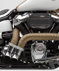 Motorcycle exhaust with Titanium Exhaust Heat Wrap With Lava Rock Technology 2 In By 25 Ft Pliable Tape, visible on pipes