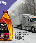 Bottle of Ultra Plus Diesel Engine Oil 15W40 Synthetic Blend API CK4 SN in front of a snow-covered semi-truck
