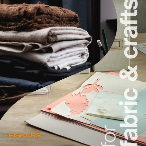 Stack of fabrics and crafting paper for use with Orange Handle Stainless Steel Scissors For All Purpose Cutting Ergonomic Design Sharp Blades For Office Crafts Paper Fabric And DIY Projects And More Everyday Creative Tasks