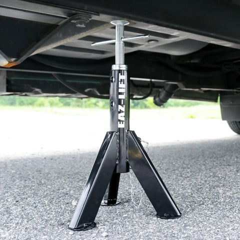 Built Tough Telescopic Rv Jack Set Of Two Adjusts Easily Between 16 And 30 Inches Quick Grip Pin Design, installed under a vehicle.