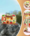 Colorful fruit-patterned mini pouch with zipper, placed on a rock outdoors, showing detailed views of design and brand label.
