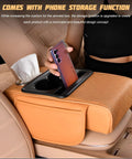 Comfy Car Center Console Armrest Pillow With Memory Foam Leather 4 In 1 Vehicle Arm Rest Cover Tissue Box Cup Holders Phone Holder Hidden Side Pockets Universal Fit Black in a car interior.