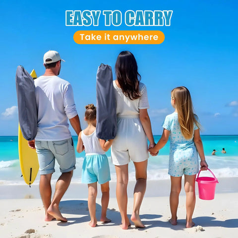 Family carrying portable foldable beach chair with umbrella for adults, navy blue, lightweight for travel at the beach.