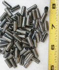 Three Sixteenth By One Half Inch Steel Roll Pins, 30 Pack Go-To Multi-Purpose Hardware Fastener Assortment Kit For DIY Projects, Rust-Resistant And High Temperature Ready, Cold Weather And Humidity Tough, Mercury-Free And Non-Toxic, shown next to a ruler for size reference.