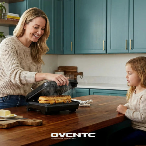 Woman using Ovente Two Serving Electric Indoor Grill And Panini Press Compact Contact Maker For Juicy Steaks Bold Smoky Flavor No Outdoor Mess Black Kitchen Appliance.