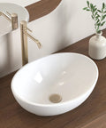 Premium Oval Ceramic Vessel Sink For Bathroom Vanity Countertop Glossy White Porcelain Bowl Above Counter on wood countertop