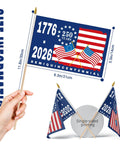 Person holding 12 Pack 250th Anniversary Flags 5x8 Inches Handheld Polyester Double Sided With Wooden Poles For Easy Assembly