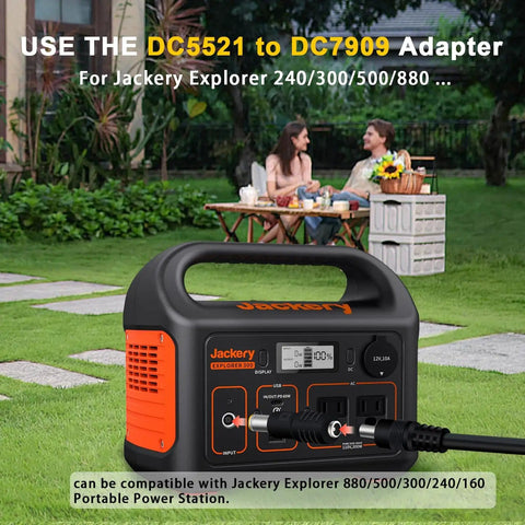 Jackery portable power station with DC5521 to DC7909 adapter cable in outdoor garden setting
