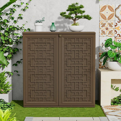 Weatherproof Indoor Outdoor Storage Cabinet With Doors And Shelf Easy Setup 34 By 16 By 36 Inches HDPE Plastic Storage Cabinet For Patio Balcony Tools Multi Purpose Organizer Brown on patio with decorative plants