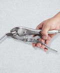 Hand using 10 Inch Locking Sheet Metal C Clamp for Fabrication and Welding, gripping metal with precision jaws.