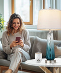 Glass Table Lamps Set Of 2 With Touch Control, 3 Way Dimmable, USB A C Charging, Sleek Teal Gradient Finish, White Fabric Shade, 27.5 Inch Tall Bedside Lamps For Living Room And Bedroom Decor That Pops on a table beside a smiling person.