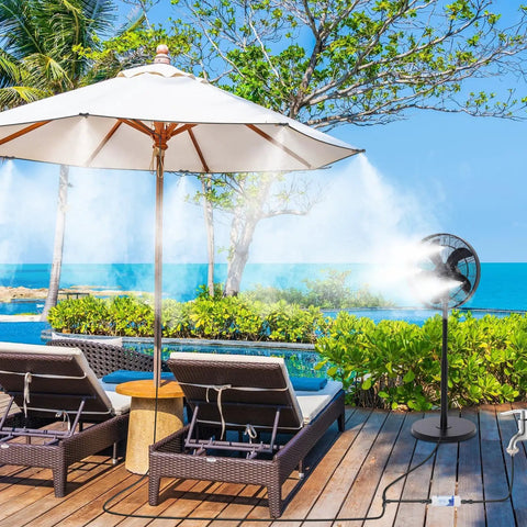 Outdoor patio misting system 26 foot kit with 9 brass nozzles and filter cooling chairs and umbrella by a pool