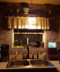 Dark Grey Fortress Stone Peel And Stick Wallpaper 394 Inch Long Self Adhesive Backsplash in kitchen with sink and decor.
