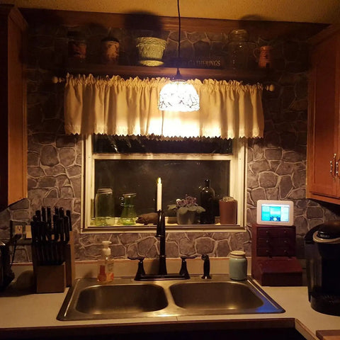 Dark Grey Fortress Stone Peel And Stick Wallpaper 394 Inch Long Self Adhesive Backsplash in kitchen with sink and decor.