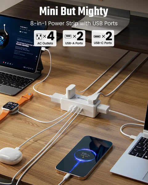 3 Ft Short Extension Cord Surge Protector Power Strip 8 In 1 with 4 AC Outlets and 2 USB C ports on a desk.