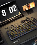 Sick Tri Mode Wireless Gaming Keyboard With Gasket Mount Mechanical Structure Hot Swappable Switches Eight Thousand Mah Battery Damped Creamy Sound Dial Knob Full Rgb Ninety Eight Layout For Beat Desktop Rig on desk with phone and tools.
