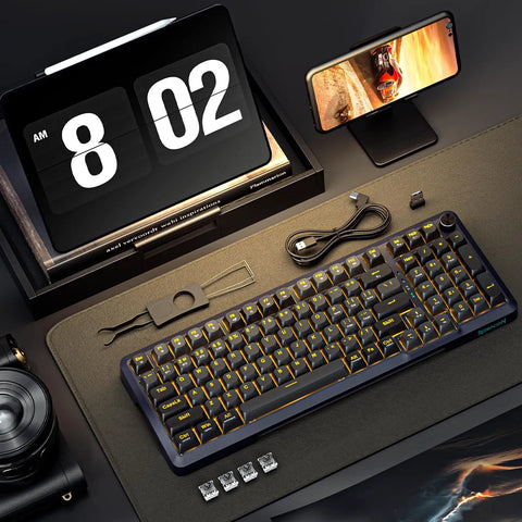 Sick Tri Mode Wireless Gaming Keyboard With Gasket Mount Mechanical Structure Hot Swappable Switches Eight Thousand Mah Battery Damped Creamy Sound Dial Knob Full Rgb Ninety Eight Layout For Beat Desktop Rig on desk with phone and tools.
