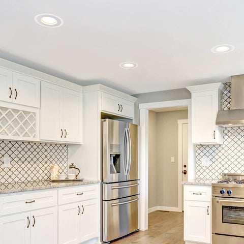 6 Inch White Goof Rings For Recessed Lights Trim 12 Pack in modern kitchen ceiling concealing lights with white cabinetry.