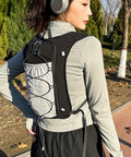 Person wearing Go To Hydration Vest For Runners And Hikers With Breathable Mesh, Lightweight Pack, outdoors