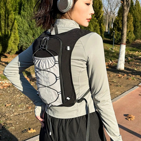 Person wearing Go To Hydration Vest For Runners And Hikers With Breathable Mesh, Lightweight Pack, outdoors