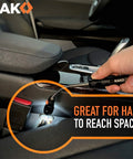 Using LED magnetic pickup tool in car for hard-to-reach spaces