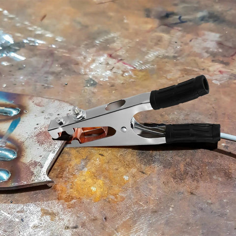 Heavy Duty Welding Ground Clamp With Copper And Iron Build Designed For Secure Earth Connection Plus Strong Load Bearing Capabilities To Keep Your Setup Safe And Steady While Getting Work Done Any Day on metal surface.