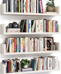 Fresh White Floating Wall Shelves Set Of Four U Shaped Wall Mounted Bookshelf with books, camera, and plant in modern decor.